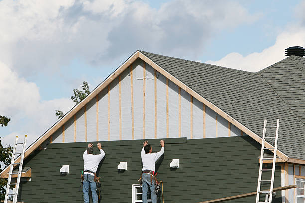 Professional Vinyl Siding technician working in West Roxbury, MA
